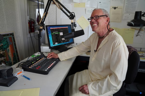 Charu Das, sits in the office of his Hare Krishna radio station, KHQN 1480 "Sounds of Transcendence," at Shri Shri Radha Krishna Temple Salt Lake City, Utah, on Friday, April 25, 2025. (AP Photo/Jessie Wardarski)
