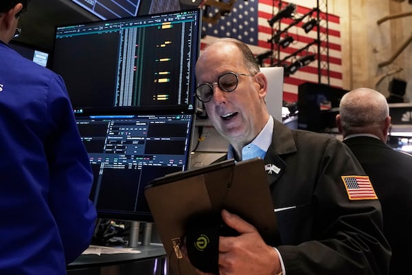 Trader Joe Dente works on the floor of the New York Stock Exchange, Tuesday, April 22, 2025. (AP Photo/Richard Drew)