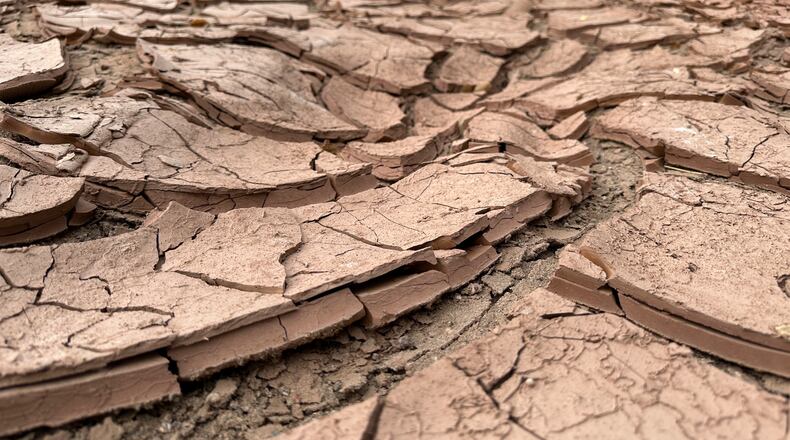 FILE - Cracked, dry mud makes up the riverbed of the Rio Grande in Albuquerque, N.M., on Thursday, Aug. 21, 2025. (AP Photo/Susan Montoya Bryan, File)