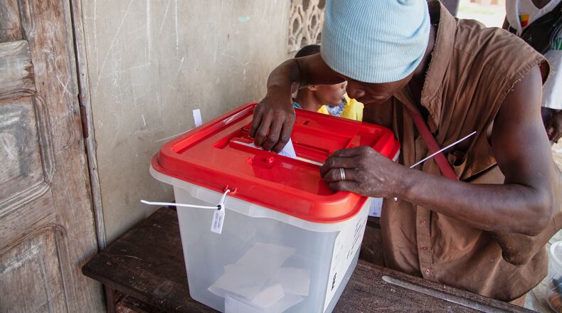 A man casts his ballot at a polling station in Cotonou, Benin, Sunday, April 12, 2026. (AP Photo/Abadjaye Justin Sodogandji)