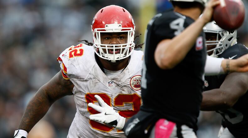 Dontari Poe #92 of the Kansas City Chiefs rushes Derek Carr #4 of the Oakland Raiders during their NFL game at Oakland-Alameda County Coliseum on October 16, 2016 in Oakland, California.