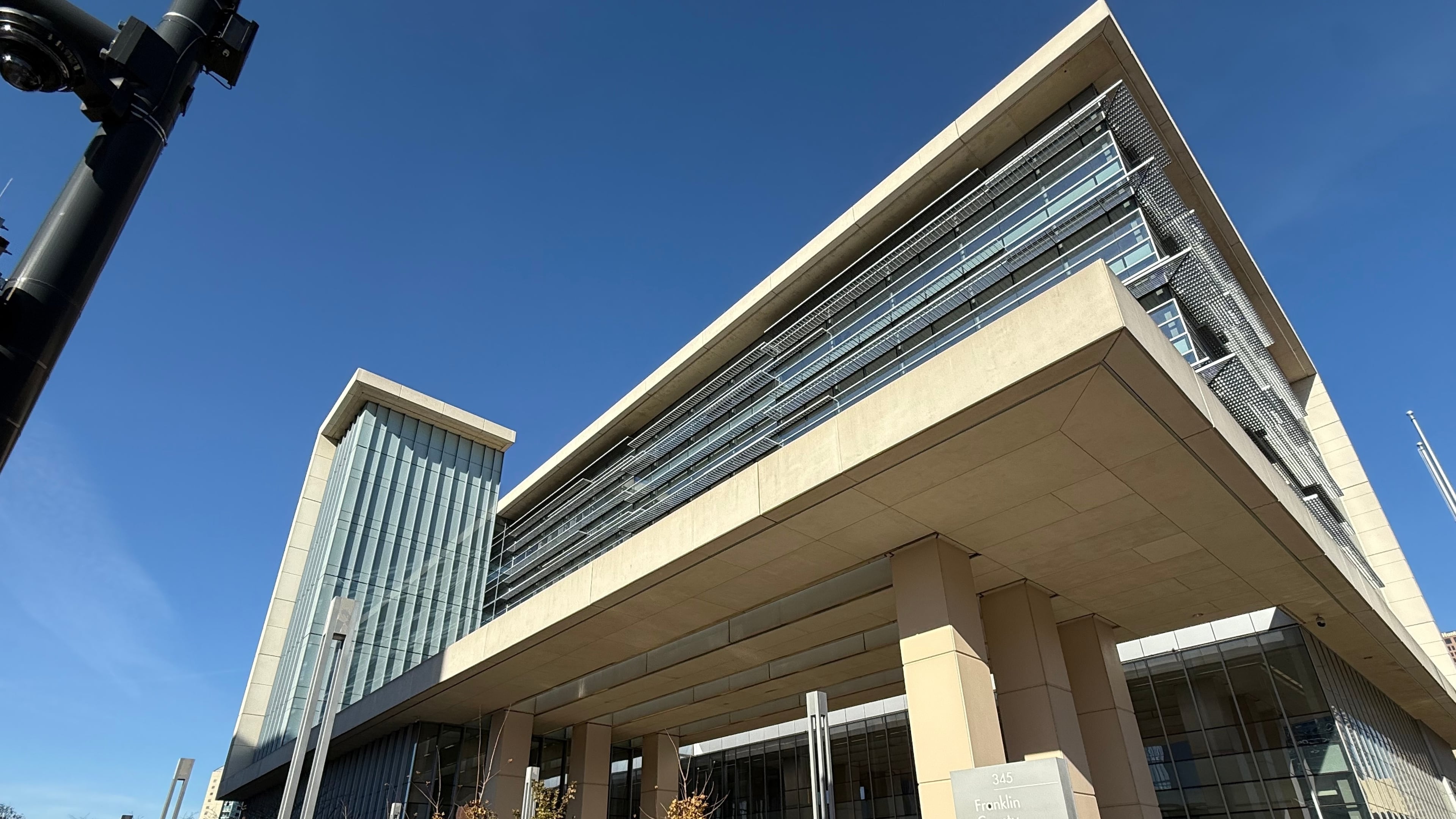 A person stands outside of the Franklin County Common Pleas Courthouse on Thursday, Nov. 13, 2025, in Columbus, Ohio. (AP Photo/Patrick Aftoora-Orsagos)