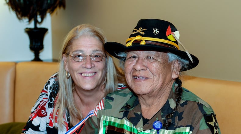 Levi Walker, who served as the Braves’ mascot Chief Noc-A-Homa from 1969 through 1985, and his wife, Teri Ficula, visit the SunTrust Club at Turner Field before a game against the Washington Nationals, Wednesday, Sept. 30, 2015, in Atlanta. This is Walker’s first Braves game since 1988. (AP Photo/Jon Barash)
