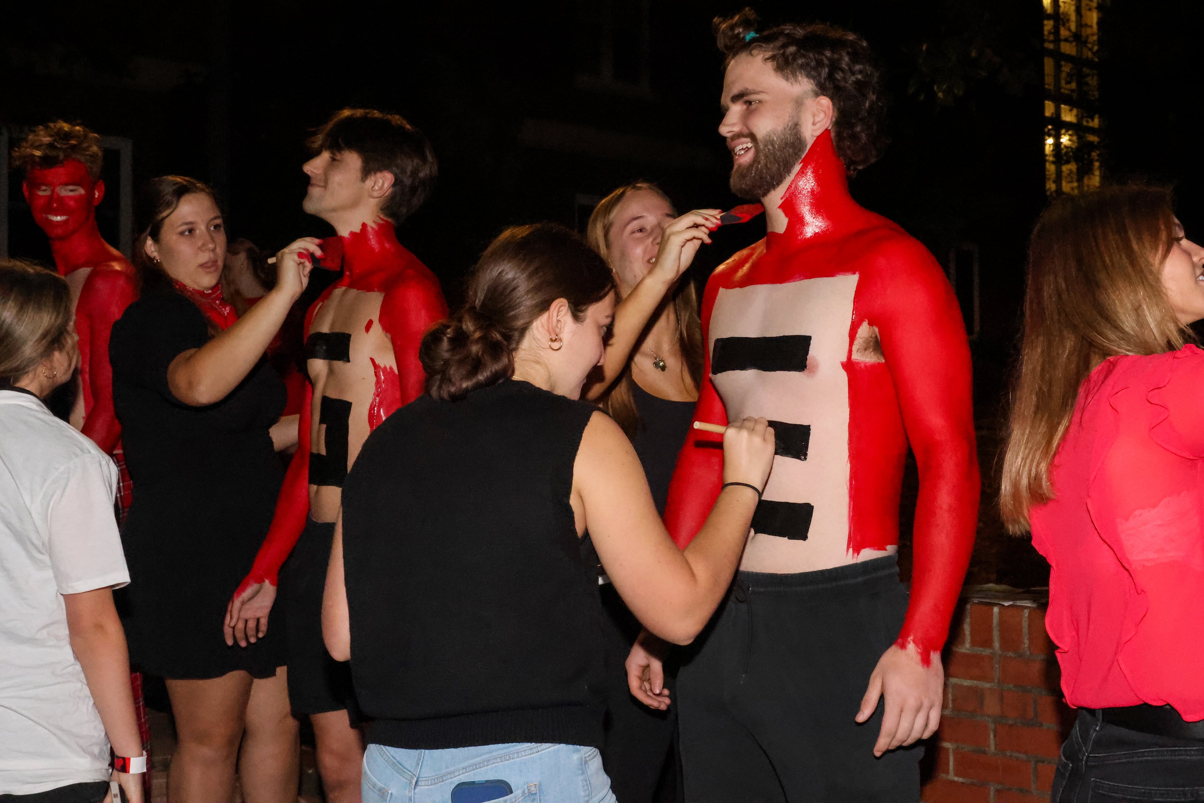 UGA fans get painted before the ESPN College GameDay broadcast from Myers Quad at UGA on Saturday, Oct. 18, 2025. (C.J. Bartunek for the AJC)