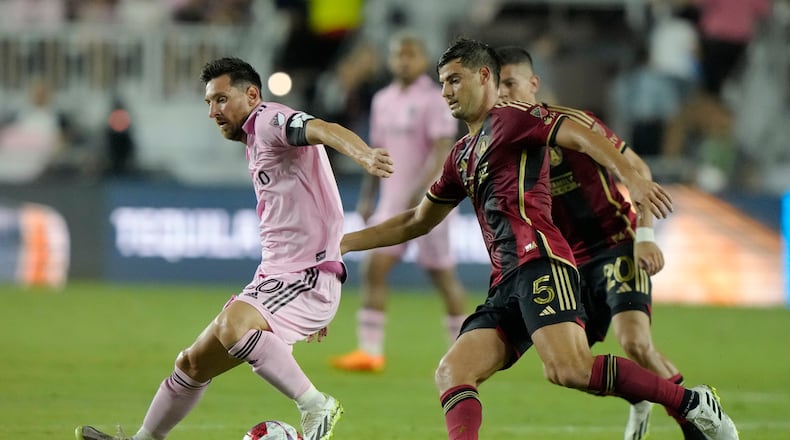Atlanta United midfielder Santiago Sosa (5) defends Inter Miami forward Lionel Messi (10) during the second half of a Leagues Cup soccer match, Tuesday, July 25, 2023, in Fort Lauderdale, Fla. (AP Photo/Lynne Sladky)