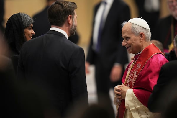 Pope Leo XIV's meets Vice President JD Vance and his wife Usha after the formal inauguration of his pontificate in St. Peter's Square, at the Vatican, Sunday, May 18, 2025. (AP Photo/Alessandra Tarantino)