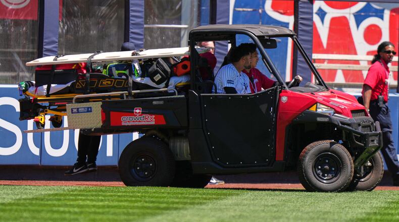 New York Yankees' Jasson Domínguez is carted off the field after an injury during the first inning of a baseball game against the Texas Rangers Thursday, May 7, 2026, in New York. (AP Photo/Frank Franklin II)