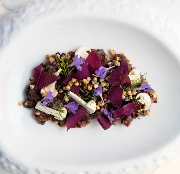 Venison tartare at Avize is a beautiful composition that has the minced game meat bound with a walnut ketchup and bulked up with buckwheat, fermented blueberries and beech mushrooms. Courtesy of Avize