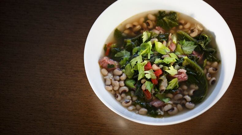 A dish involving field peas and mustard greens in smoky potlicker, in Tuskegee, Ala., Dec. 18, 2015. Black-eyed peas may be customary for New Year’s Day, but field peas help sustain the rural Alabama economy. (Dustin Chambers/The New York Times)
