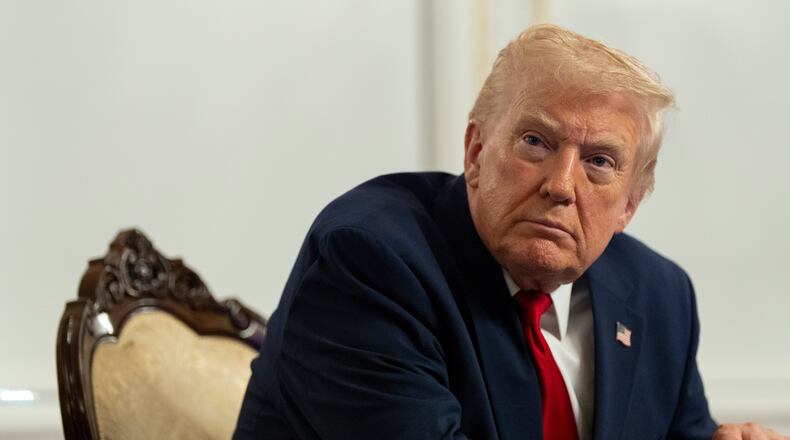 President Donald Trump speaks to reporters after speaking to troops via video from his Mar-a-Lago estate on Thanksgiving, Thursday, Nov. 27, 2025, in Palm Beach, Fla. (AP Photo/Alex Brandon)
