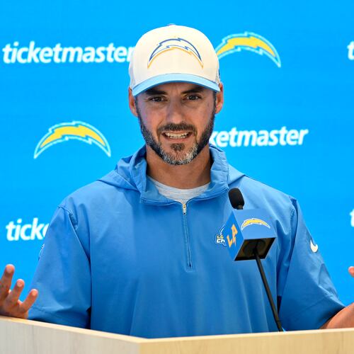 FILE -Los Angeles Chargers defensive coordinator Jesse Minter speaks at a news conference during NFL football training camp Friday, July 26, 2024, in El Segundo, Calif. (AP Photo/John McCoy, File)