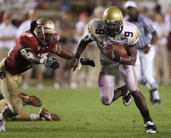 Georgia Tech quarterback Josh Nesbitt, right, runs for fourth quarter yardage as Florida State's Nigel Bradham, left, attempts to make the tackle during an NCAA college football game, Saturday, Oct. 10, 2009, in Tallahassee, Fla.  Georgia Tech won 49-44. (AP Photo/Phil Coale)