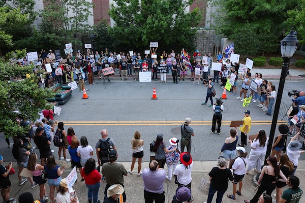 Tim Denson, a mayoral candidate for the city of Athens, speaks to the crowd gathered on Foundry Street in Athens, on Tuesday, April 14, 2026. The protest was held in response to the Turning Point Tour at the University of Georgia, featuring Vice President J.D. Vance and CEO of Turning Point USA Erika Kirk. (Felix Scheyer for the AJC)