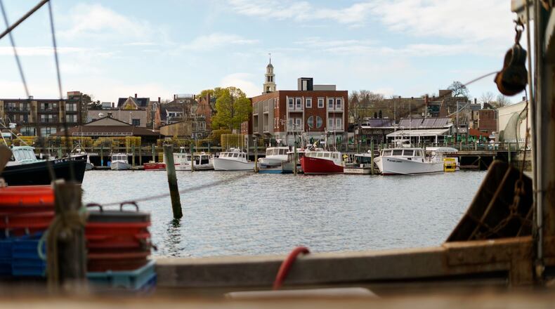 FILE - Fishing boats are docked in the harbor of Gloucester, Mass., May 11, 2022. (AP Photo/David Goldman, File)