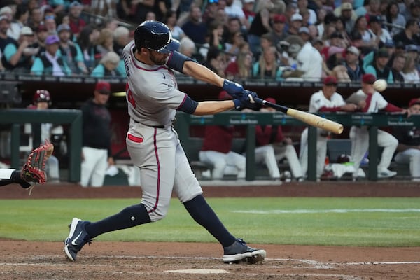 Atlanta Braves' Eli White hits a two-run home run against the Arizona Diamondbacks in the seventh inning during a baseball game, Saturday, April 26, 2025, in Phoenix. (AP Photo/Rick Scuteri)