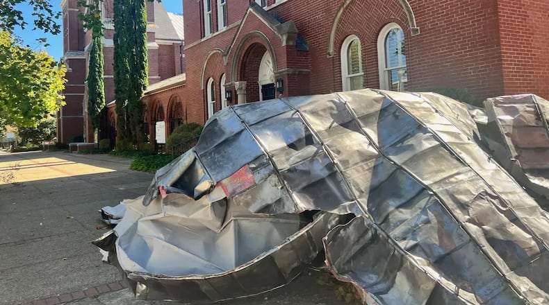 A portion of the St. John United Methodist Church's roof lies on the sidewalk. (Photo Courtesy of Charmain Z. Brackett/Augusta Good News)