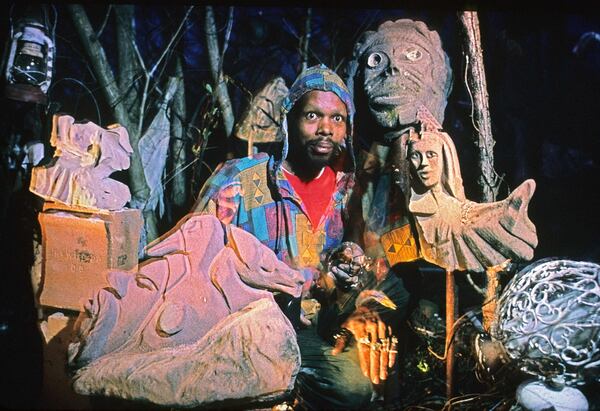 Holley with some of his outdoor sculptural creations from recycled materials. “Everything I do is an offering to the spirits,” says the artist. 