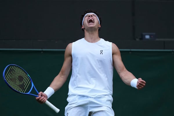 Ben Shelton of the U.S. celebrates after beating Marton Fucsovics of Hungary during their men's singles third round match at the Wimbledon Tennis Championships in London, Saturday, July 5, 2025.(AP Photo/Alastair Grant)