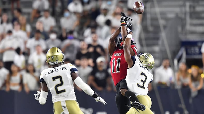 September 4, 2021 Atlanta - Northern Illinois' wide receiver Messiah Travis (11) is not able to catch under pressure from Georgia Tech's defensive back Tre Swilling (3) during the second half of an NCAA college football game at Georgia Tech's Bobby Dodd Stadium in Atlanta on Saturday, September 4, 2021. Northern Illinois won 22-21 over Georgia Tech(Hyosub Shin / Hyosub.Shin@ajc.com)
