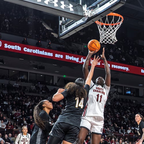 South Carolina center Madina Okot (11) shoots the ball over Vanderbilt forward Aiyana Mitchell (14) during the first half of an NCAA college basketball game Sunday, Jan. 25, 2026, in Columbia, S.C. (AP Photo/David Yeazell)