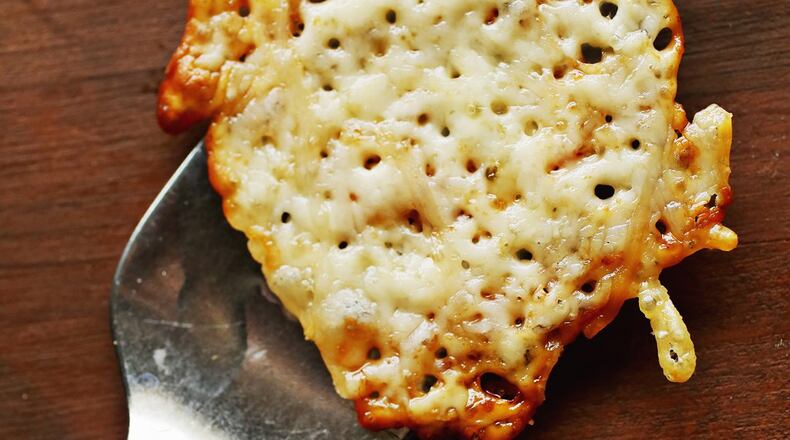 These Parmesan-Pepper Jack Cheese Crisps are a fun nibble for your guests. (Juli Leonard/TNS)