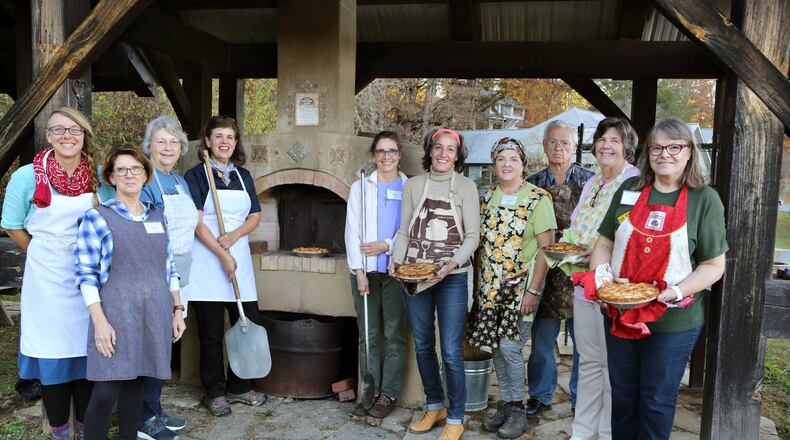 Participants in the John C. Campbell Folk School culinary class during its recent Shaker-themed week learned various Shaker cooking methods and recipes. Shown from left are teaching assistant Bonnie Lenneman, Teresa Pratt, Cindy Brannon, instructor Nanette Davidson, Diana Kealey, AJC food and dining editor Ligaya Figueras, Marcia Barbiero, Tim Parmley, Susan Greene and Gwen Kephart. CONTRIBUTED BY JOHN C. CAMPBELL FOLK SCHOOL