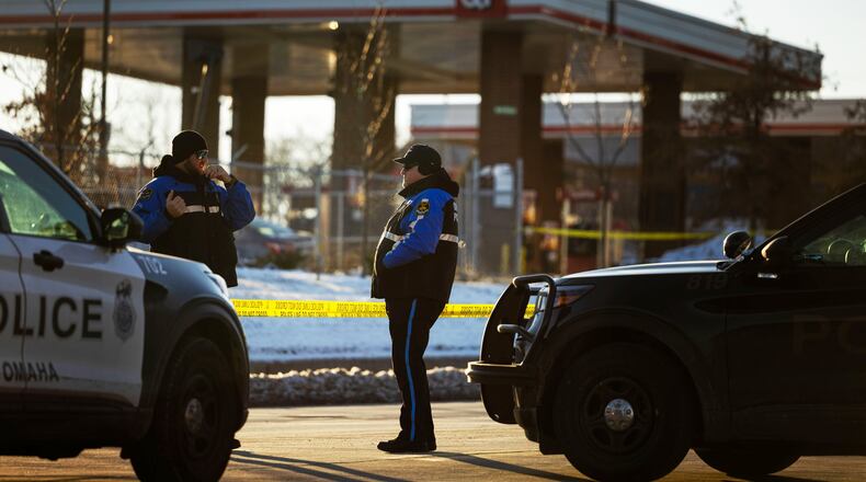 Omaha police investigate an incident at a QuikTrip gas station, that injured three officers and left the suspect dead in Omaha, Neb., Wednesday, Dec. 3, 2025. (Chris Machian/Omaha World-Herald via AP)