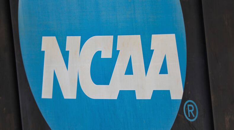 FILE - An NCAA logo displayed on the fence before an NCAA softball game between Jacksonville and FGCU, March 24, 2024, in Jacksonville, Fla. (AP Photo/Gary McCullough, File)