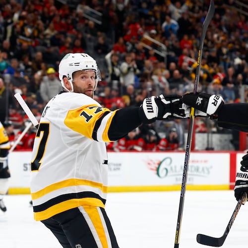 Pittsburgh Penguins right wings Bryan Rust (17) celebrates with Egor Chinakhov (59) after scoring a goal against the New Jersey Devils during the first period of an NHL hockey game, Thursday, April 9, 2026, in Newark, N.J. (AP Photo/Noah K. Murray)
