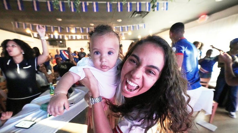 Cape Verde supporters celebrate their side's second goal as they watch the World Cup Group H soccer match between Uruguay and Cape Verde at a restaurant at a Cape Verde community in Brockton, Mass. near Boston, Sunday, June 21, 2026. (AP Photo/Martin Meissner)