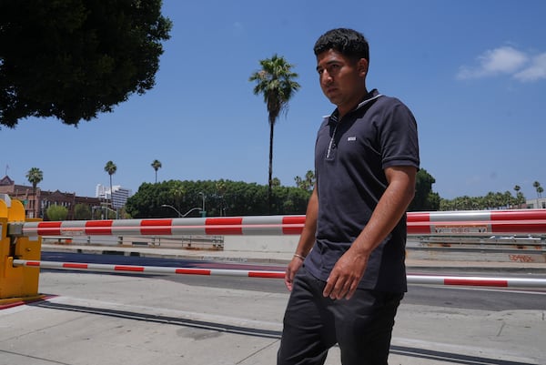 Alejandro Barranco arrives at the Metropolitan Detention Center to check on his father Narciso, who was recently detained by federal agents, on Monday, June 23, 2025, in Los Angeles. (AP Photo/Damian Dovarganes)
