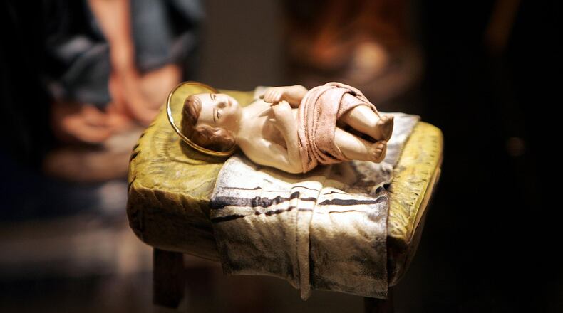 FILE PHOTO: A sculpture of a baby Jesus that is part of a nativity scene from Spain is displayed during a "Joy to the World"  exhibit .
