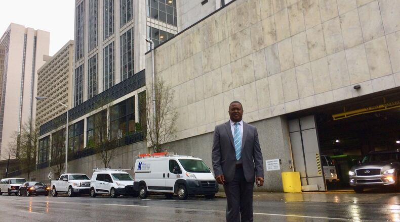Matthew Peterson, standing in the middle of Baker Street during a late-morning lull, is the face of the opposition to converting that downtown Atlanta road into a two-way. Photo by Bill Torpy