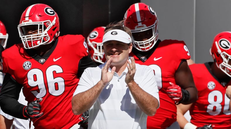 Georgia head coah Kirby Smart takes the field with the Bulldogs for pre-game warm ups against the Middle Tennessee Blue Raiders Saturday, Sept 15, 2018, at Sanford Stadium in Athens.
