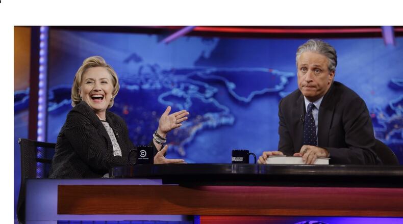 Former U.S. secretary of state Hillary Rodham Clinton reacts to host Jon Stewart during a taping of "The Daily Show with Jon Stewart, " on Tuesday. AP/Frank Franklin II