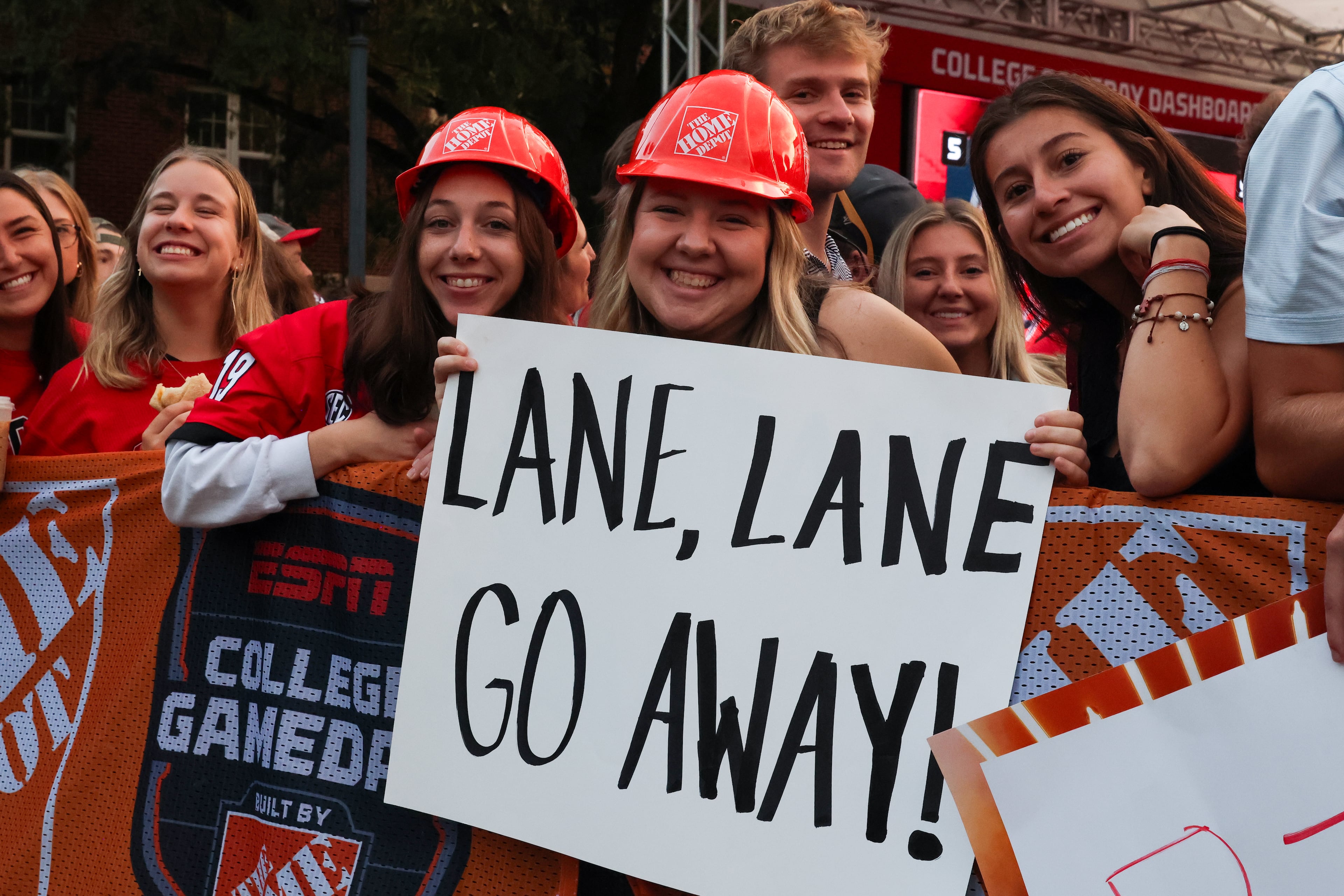 UGA fans hold up signs before the ESPN College GameDay broadcast from Myers Quad at UGA on Saturday, Oct. 18, 2025. (C.J. Bartunek for the AJC)