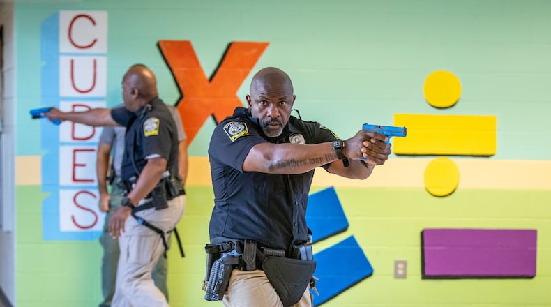 Atlanta Public Schools police officers participate in an active shooter training drill at the former Towns Elementary School in Atlanta on Thursday, July 28, 2022. (Steve Schaefer / steve.schaefer@ajc.com)