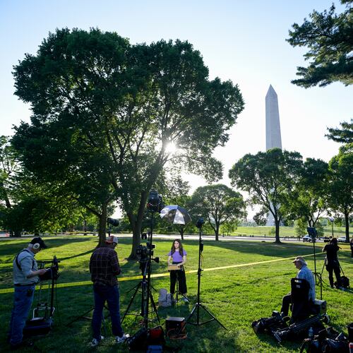 Journalists report as U.S. Secret Service and local police remain after a person was shot by law enforcement near the Washington Monument in Washington, Monday, May 4, 2026. (AP Photo/Rod Lamkey Jr.)