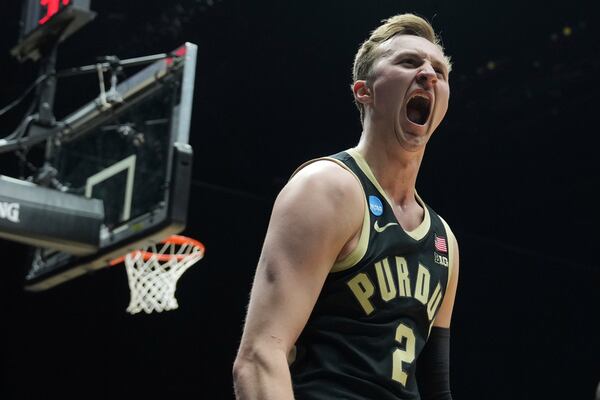 Purdue's Fletcher Loyer (2) celebrates after scoring during the first half in the Sweet 16 of the NCAA college basketball tournament against Houston Friday, March 28, 2025, in Indianapolis. (AP Photo/Michael Conroy)