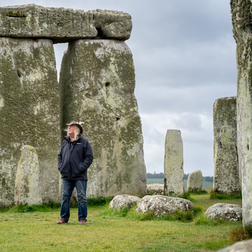 This photo provided by Wessex Archaeology shows archaeologist Phil Harding standing at Stonehenge in May 2026, near Salisbury, England. (Wessex Archaeology via AP)