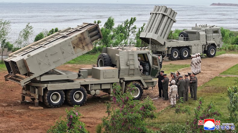 In this photo provided by the North Korean government, its leader Kim Jong Un, center right, inspects the multiple weapons systems, at an undisclosed location, North Korea, Tuesday, May 26, 2026. Independent journalists were not given access to cover the event depicted in this image distributed by the North Korean government. The content of this image is as provided and cannot be independently verified. Korean language watermark on image as provided by source reads: "KCNA" which is the abbreviation for Korean Central News Agency. (Korean Central News Agency/Korea News Service via AP)