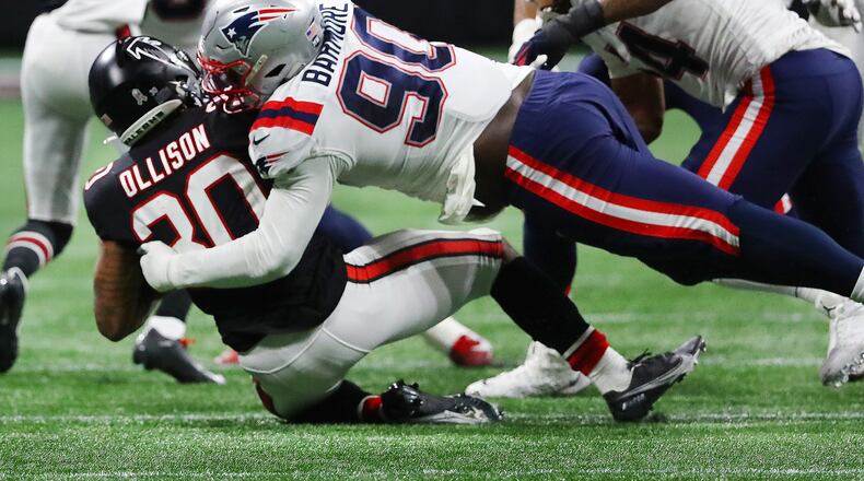 111821 Atlanta: Falcons running back Qadree Ollison is leveled at the line of scrimmage by Patriots defensive lineman Christian Barmore during the second half in a NFL football game on Thursday, Nov. 18, 2021, in Atlanta. “Curtis Compton / Curtis.Compton@ajc.com”