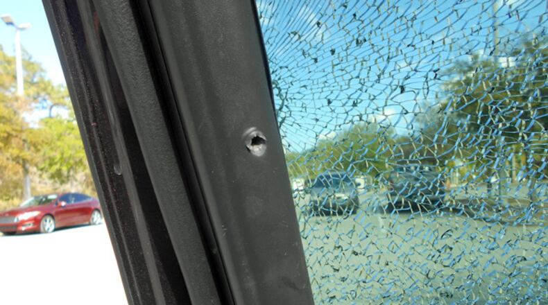 A 3-year-old boy sitting in a car in a Deltona, Florida, school parking lot grabbed a woman's loaded gun as she was outside the vehicle and shot out the car's window on Monday, March 20, 2017, sheriff’s deputies said.