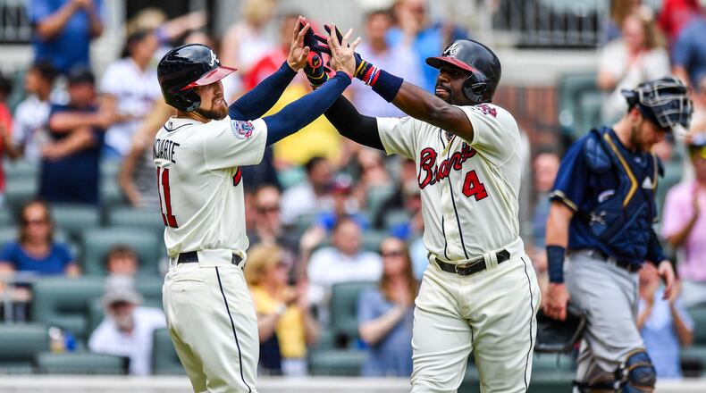 Atlanta Braves second baseman Brandon Phillips, right, high-fives Ender Inciarte, left, after hitting a two-run home run during the third inning of the team's baseball game against the Milwaukee Brewers on Saturday, June 24, 2017, in Atlanta. Keeping up with the Braves and other Atlanta teams just got easier. Follow @ajc_sports on Instagram for news, photos, and videos of your favorite teams. (AP Photo/Danny Karnik)