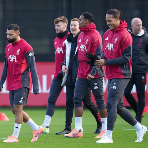 Liverpool's Mohamed Salah, left, takes part in a training session as manager Arne Slot, right, looks on in Liverpool, England, Monday, Dec. 8, 2025. (AP Photo/Jon Super)