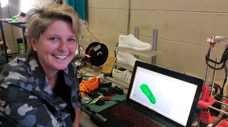 Lucy Beard moved her tech startup from California to Chattanooga for several reasons, including the area’s super fast Internet connections. Her company, Feetz, makes customized shoes using 3D printing. MATT KEMPNER / AJC