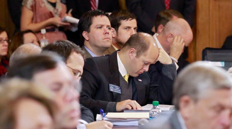 State Sen. Hunter Hill, R-Atlanta, an appropriations committee member, follows along as Gov. Nathan Deal addresses the joint House and Senate budget committees earlier this week. Bob Andres, bandres@ajc.com