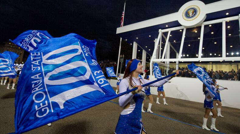 Rachel Wahaus of the Georgia State University Marching Band Color Guard performs during the 2013 inaugural parade. Georgia may be represented in the upcoming inaugural parade, but the connection was a little sketchy on Friday. President-elect Donald Trump’s inaugural committee identified a band selected for the parade, Kids Overseas, as being from Richmond Hill, but nobody in the southeast Georgia city knows anything about it. The band, Trump representatives said, is part of a Department of Defense program at a school for American children of military personnel at a naval station in Italy.