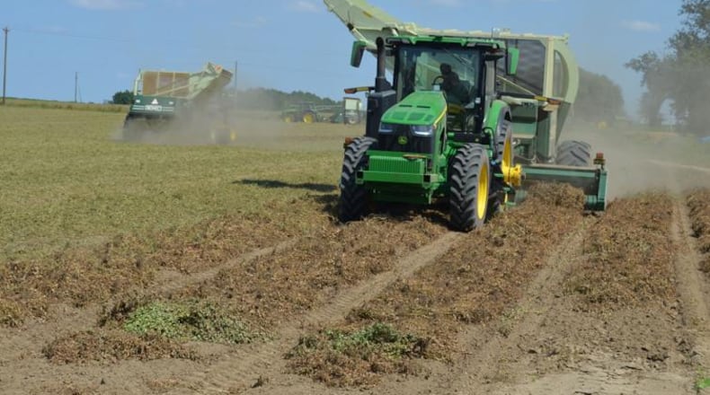 Three tractors dig peanuts in a Worth County field on Friday. Baker, Mitchell and Worth counties are among the top 10 percent producers in the state. (Courtesy of Alan Mauldin)
