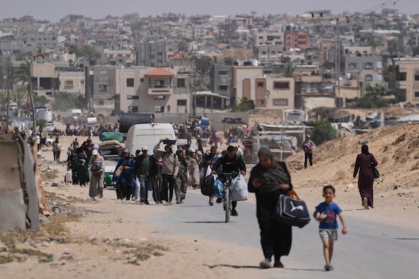 Displaced Palestinians flee from Khan Younis, Gaza, amid the ongoing Israeli military offensive in the area, on Monday, May 19, 2025. (AP Photo/Abdel Kareem Hana)